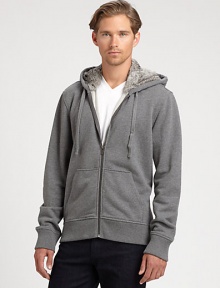 Soft rabbit fur lines the hood of this classic hoodie, finished in comfortable cotton for extra warmth.Zip frontAttached drawstring hoodKangaroo pocketsRibbed knit cuffs and hemCottonMachine washImportedFur origin: China