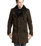 THE LOOKFaux shearling layered notch collarConcealed front zipperDouble-breasted button frontEpaulettesDual chest gun flapsFront zip pocketThree angled snap flap pocketsLong sleeves with zip cuffsBack button storm flapBack side vents with zipper closuresDual inside besom pocketsTHE FITAbout 37 from shoulder to hemTHE MATERIALShell: cottonFaux fur lining: 50% polyester/50% acrylicCARE & ORIGINMachine washImported