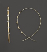 Diamond dot Lana's slim, elegant 14K yellow gold hoop earrings.