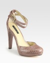 Sassy snake-embossed leather style with adjustable ankle straps and a slight platform. Self-covered heel, 4½ (115mm)Covered platform, ½ (15mm)Compares to a 4 heel (100mm)Snakeskin upperLeather lining and solePadded insoleImportedOUR FIT MODEL RECOMMENDS ordering true size. 