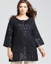 Look stunning in sequins when you wear this Lafayette 148 New York linen tunic. Perfect for topping slim pants, it also doubles as a daring dress with opaque tights and heels.