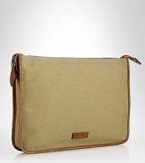 A sleek leather-trimmed canvas construction makes this portfolio a polished pick for stowing and transporting important documents.