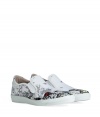 Inject effortless edge into every outfit with McQ Alexander McQueens printed canvas slip-ons, a uniquely cool choice for dressing up or down - Round toe, black-multi printed white canvas uppers, logo on outside of heel, elastic inserts, white rubber sole, slips on - Wear with slim fit trousers, a graphic tee and hoodie, or as a sartorial finish to summer suits