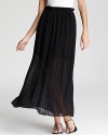 This Joie maxi skirt of finely pleated silk is sheer from mid-thigh to ankle, offering an unexpected peek of skin.