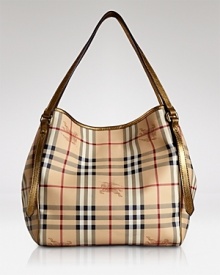 Give your look a classic finish with Burberry's leather-trimmed tote in the brand's iconic check. Give your look a classic finish with Burberry's leather-trimmed tote in the brand's iconic check.