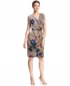 A striking floral print climbs from the hem of this Jones New York dress. An elegant cowl neckline crowns the look.