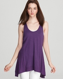 A fluttery dipped hem lends movement to this Eileen Fisher tunic. Team with skinnies and a bold pump for a night out.