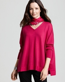 Chic bracelet sleeves balance the relaxed, boxy silhouette of this easy Eileen Fisher wool sweater, flourished in a bright berry hue.