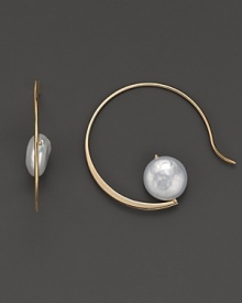 Elegantly shaped 14K yellow gold hoops cradle gleaming cultured coin pearls. Elegantly shaped 14K yellow gold hoops cradle gleaming cultured coin pearls.