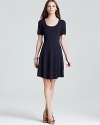 Destined to be a future classic, this Shoshanna dress boasts an intricate cutout pattern at the hem for added interest.