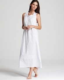 An elegantly long nightgown with lace trim along neckline.