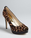 Your favorite peep toe platform pump style goes wild, in a bold, cheetah print on luxe haircalf; it's sheer animal appeal by MICHAEL Michael Kors.