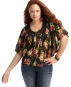 Flaunt your flirty side with ING's butterfly sleeve plus size top, featuring a floral print and lace trim.