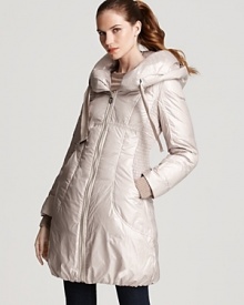 This cozy Elie Tahari down coat flaunts a plush hood and streamlined silhouette for winter-perfect style.