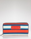 Practical accessories have a place in every it-girl's purse. But in vivid stripes, this croc-embossed rubber from MARC BY MARC JACOBS is almost too chic to keep inside.