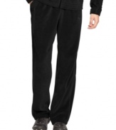 Make a run for it! You'll stay comfortable no matter what speed you're going in these velour track pants from Puma.