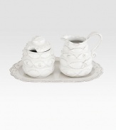 A charming, richly textured three-piece ceramic set fit for the breakfast nook and dinner table alike includes a lidded sugar bowl, creamer and scalloped tray. Sugar, 4½H X 3¼ diameter Creamer, 4½H X 4½ diameter Tray, 10L Dishwasher safe Imported 