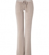 Styled this season with a slightly wider waistband and slimmer cut around the knee, Juicy Coutures iconic pants fit better now than ever! - Drawstring waistline, flared leg, snapped back pockets, shiny gold-toned hardware - Figure-hugging fit, sits low on the hips - Style with a tee and cozy pullover, or for a sportier look, with a matching hoodie and flats