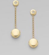 A luminous diamond and 18k yellow gold circle are connected by a delicate chain.Diamond, 0.10 tcw 18k yellow gold Drop length, about 1½ Post backs Imported