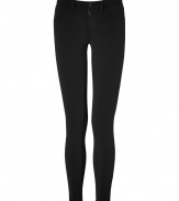 A closet must-have, these super skinny pants in black stretch nylon are a signature design from J Brand Jeans - Classic five-pocket style, mid-rise waist, zip fly front, belt loops, flattering back pockets - Narrow leg and figure-flattering slim cut - Wear with a chunky-knit oversized sweater and favorite ankle booties