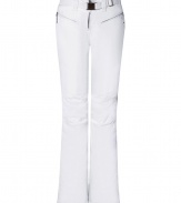 Make a chic statement on the slopes in Jet Sets bright white ski pants, finished with a flattering cut guaranteed to show off your sporty side in style - Zip fly, zippered front pockets, adjustable belt in front, straight leg with silver star circle print, flared zippered ankles, elasticized band at the ankle with silicon for hold - Fitted through the knee - Wear with figure-hugging turtlenecks and cozy shearling lined boots