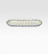 A unique addition to any home, handcrafted in an oblong shape from fluted metal with opalescent, crushed mother-of-pearl enamel. Food safe Engraved signature 14W X 1H X 5D Hand wash Imported 