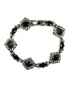 Effortless elegance. Dress up your look with this fashionable flex bracelet from Givenchy. Embellished with jet and black glass accents, it's crafted in silver tone mixed metal. Approximate length: 7-1/4 inches.