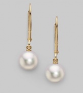 From the Akoya Collection. Classic white cultured pearl drops set in 18k gold. 7mm white round cultured pearls Quality: A+ 18k yellow gold Drop, about 1 Ear wire Imported