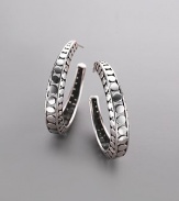From the Pierced Dot Collection. Open dots create a graphic look in a sterling silver hoop with a modern air. Sterling silver Diameter, about 1¼ Post back Made in Bali