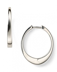 Finish your look with an ellipse. Elizabeth and James' silver hoop earrings are a directional play on shape.