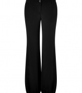 These classic wide leg pants feature an elasticized cuff for a cool, cutting-edge flowing silhouette -Zip with button closure, belt loops, relaxed silhouette, elasticized cuffs - Style with a fitted blouse, a bold shoulder blazer, and platform pumps