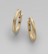 From the Martellato Collection. Soft, romantic grooves put a vintage texture to classic, 18k yellow gold hoops. 18k yellow gold Diameter, about 1 Hinge close Made in Italy 