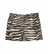 Show off your assets in style with these luxe zebra print shorts from Michael Kors - Mini length, zip with button closure, belt loops, off-seam pockets, back welt pockets with button, all-over zebra print- Style with a billowy blouse, platform sandals, and an oversized satchel