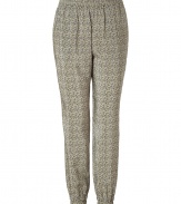 Stylish pants in fine, gray-yellow patterned silk - Fashionable, slightly ruffled harem silhouette has a slim but casual cut - Features comfortable elastic waist, leg cuffs, two pockets at side and back - Trendy pants looks great with a simple tee, boyfriend cardigan and flats