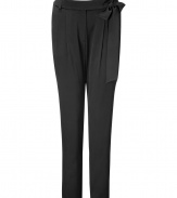 Extremely elegant and stylish trousers in black stretch silk - The perfect alternative to the classic suit pant - Wider cut at top with narrow tapering at legs - With decorative side bow at waist - Side pockets at hips - Pair with a blazer or wear solo with a silk top and strappy heels