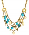 Infuse your look with a taste of the tropics year round. T Tahari's exotic statement necklace combines metallic rings with bright turquoise and polished ivory resin beads. Set in antique gold tone mixed metal. Base metal is nickel-free for sensitive skin. Approximate length: 17 inches + 3-inch extender. Approximate drop: 2 inches.