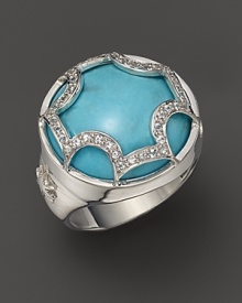 This bold turquoise dome ring, set in sterling silver, gets a dramatic finish with a white sapphire Maltese cross. By Elizabeth Showers.