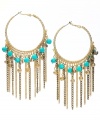 INC International Concepts take traditional hoops to a whole, new level. Trendy fringe and plastic turquoise beading mixed with diamond dust beads and glass rondelles create a head-turning style. Set in mixed metal. Approximate drop: 2-1/4 inches.