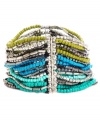 Plant the seeds of good style. Kenneth Cole New York's trendy stretch bracelet combines multiple rows of blue, green and silver seeds beads. Set in silver tone mixed metal. Approximate diameter: 2-1/2 inches.