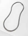 Signature woven chain necklace with hammered disc pendant and a carved chain clasp, designed by John Hardy.