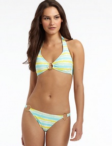 THE LOOKAllover tie dye printEmbellished O-ring detailPadded cupsBack tie closureTHE MATERIAL80% nylon/20% spandexFully linedCARE & ORIGINHand washMade in USAPlease note: Bikini bottom sold separately. THE LOOKAllover tie dye printEmbellished O-ring detailPadded cupsBack tie closureTHE MATERIAL80% nylon/20% spandexFully linedCARE & ORIGINHand washMade in USAPlease note: Bikini bottom sold separately.