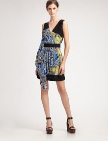 A graphic floral print in a two-tone color combination with pleated and draped front panel.V-neck Wrap front Pleated, draped front panel Banded waist and hem Gathered rear yoke About 20 from natural waist Silk; dry clean Imported Additional Information Women's Premier Designer & Contemporary Size Guide 