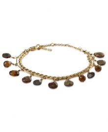 Fossil puts the accent on style with this dual-chain bracelet. Semi-precious accents find a home on the gold-tone mixed metal bracelet with a lobster-claw closure. Approximate length: 7-1/2 inches + 1-1/2-inch extender.