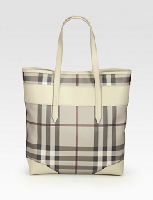 Iconic trench check printed coated denim accented in luxuriously smooth leather.Double leather shoulder straps, 7½ dropMagnetic snap closureOne inside zip pocketTwo inside open pocketsCotton lining13W X 15H X 3½DMade in Italy Iconic trench check printed coated denim accented in luxuriously smooth leather.Double leather shoulder straps, 7½ dropMagnetic snap closureOne inside zip pocketTwo inside open pocketsCotton lining13W X 15H X 3½DMade in Italy