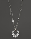 From John Hardy's Dot Deco Collection, a double-disc pendant with circle detail and link etching. Hangs on a sautoir chain with interspersed ring accents. Designed by John Hardy.