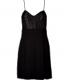 Chic dress in fine black wool crepe - Empire style with on-trend pleated skirt - Elegant, lace detail bodice - Spaghetti straps, back tassel zip - Slim, A-line silhouette, cut to hit above the knee - A sexy, sophisticated must for cocktails and evening events - Style with a cropped leather jacket or cardigan and pumps or ankle booties