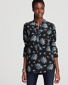 Invest in luxury with this silk Equipment blouse, cut with a feminine round collar and partial front placket. Featuring a fresh floral print for fall's chicest trend, this look brings light to your every look.