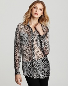 Spots abound on this chic animal print Equipment blouse rendered in breezy silk.