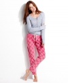 Embrace the soft, stylish comfort of Kensies pajamas set. The henley top features a rounded hem and small pocket on the left breast. The printed fleece pajama pants feature a comfy elastic waist and drawstring.
