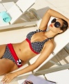 A classic polka dot print and a flirty floral applique make Kenneth Cole Reaction's halter bikini top stand out!